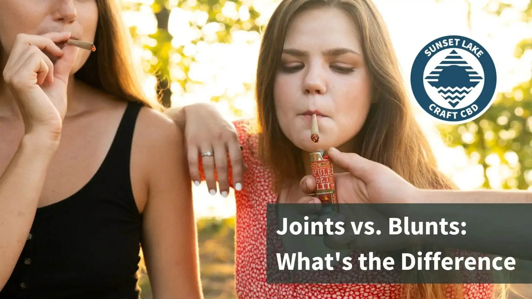Two women smoking pre-rolled hemp joints