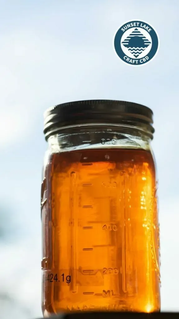 A jar of full spectrum CBD distillate used to make CBD oil 