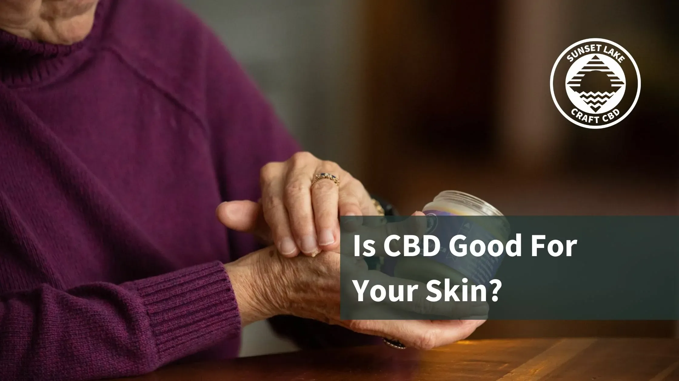 Woman rubbing CBD salve on her wrist. Text reads "Is CBD Good For Your Skin?"