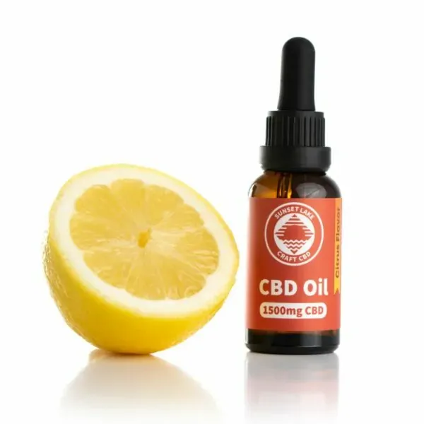 Citrus-flavored 1500mg CBD oil next to half of a lemon