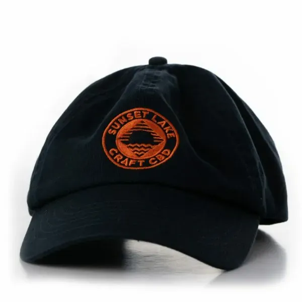 Dark blue dad hat with Sunset Lake CBD orange logo on the front