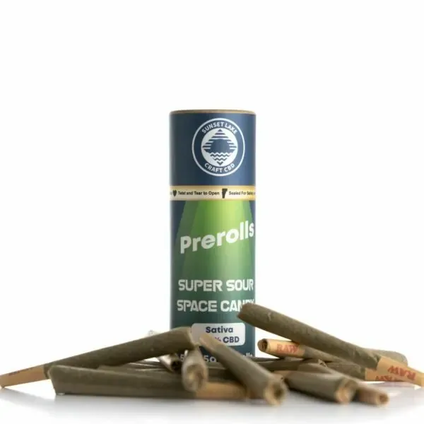 A tube of Super Sour Space Candy Prerolls surrounded by pre-rolled joints